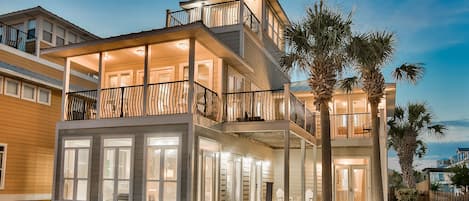 View of front of house with numerous bedrooms/decks with views of Gulf of Mexico