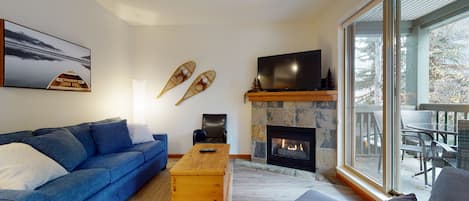 Living area with fireplace and TV