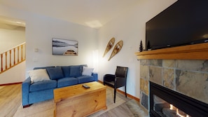 Living area with fireplace and TV