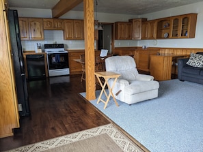 Entryway view of Living Space and Kitchen.