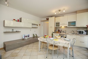 The spacious living room with dining area