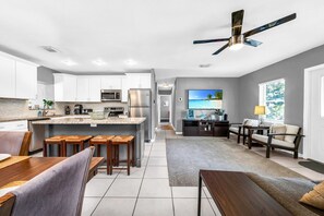 Large kitchen and dining area, and 2 seating areas.