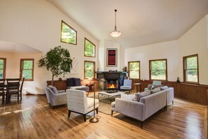 Cozy up in this luxuriously designed living room, complete with a wood-burning fireplace! Who's ready for the perfect fireside night in?