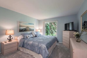 Snuggle up in a luxury spacious KING  bedroom featuring  plush luxurious  soft, layered linens, warm lighting, and inviting decor. Perfect for restful nights and lazy mornings.