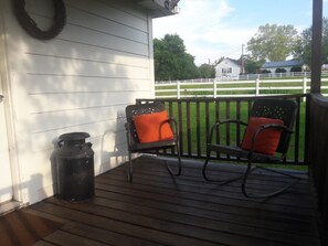 The rear deck is a great place to relax and take in views of the farm.