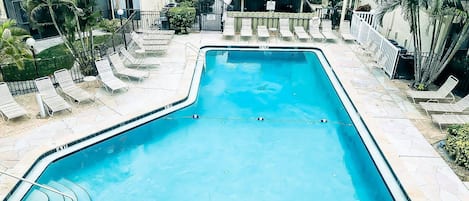 The condo has a great view of the heated community swimming pool.  Grab one of the provided beach towels and relax on a lounger.
