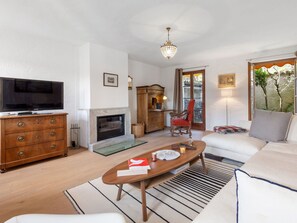 Furniture, Property, Couch, Cabinetry, Table, Picture Frame, Comfort, Wood, Interior Design, Living Room