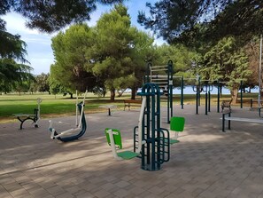 Playground, Public Space, Outdoor Play Equipment, Human Settlement, Swing, Tree, Park, City, Leisure, Recreation