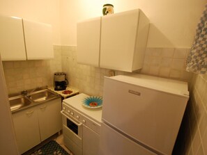 Room, Property, Furniture, Cabinetry, Floor, Interior Design, Major Appliance, Sink, Countertop, Kitchen