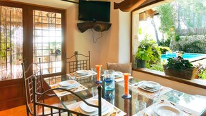 Charming interior dining room with exit to the garden.