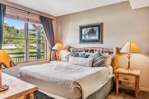 Bedroom 1: King bed, TV, dresser, closet, en-suite bath
