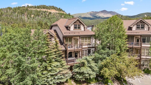 Exterior: View of the building, unbeatable location a short walk to Main Street and downtown Breck, the 2nd story condo is located in, serene forested surroundings