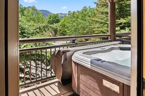 Exterior: Private balcony, hot tub, forested views