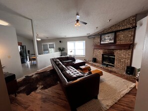 Living Room w/projector screen up. 