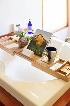 The master bath has a truly unique experience! The Japanese soaking tub faces gorgeous views of Roan Mountain and is the epitome of relaxation!