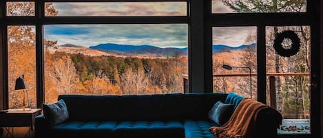The views from the living room just as you enter the house are stunning. Each of the picture windows create a frame of nature’s beauty.
