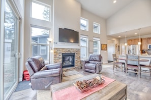 Living Area - Multiple windows paired with the vaulted ceiling allows for plenty of natural to flow through.