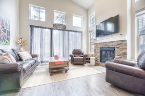 Living Area - Three-piece living room set with gas fireplace and flat screen TV.