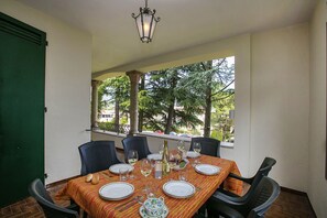 The portico terrace with a dining set
