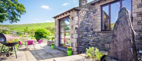 Front of Coomb View with Slate Water Feature and Herb Garden