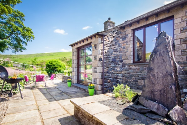 Front of Coomb View with Slate Water Feature and Herb Garden