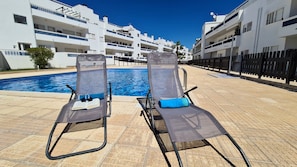 Pool area with chairs