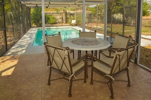 Outdoor seating with propane gas grill. Pool is not heated nor caged.
