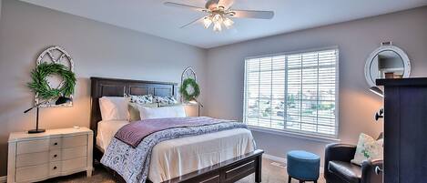 Master bedroom with queen bed, walk in closet, smart TV