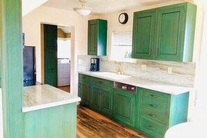 Gorgeous granite tops and custom cabinets add a modern touch to a vintage home.