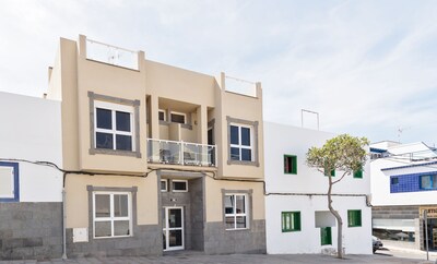 Town center and 200m to Beach. Private Patio and Shared Rooftop Terrace