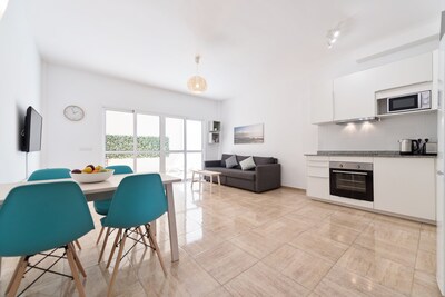 Town center and 200m to Beach. Private Patio and Shared Rooftop Terrace