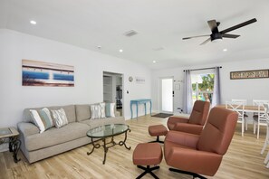 Entrance leading to living room with recliner chair