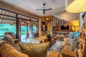 The living area leads out to the pool and patio area.