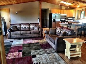 New high quality sofa sleeper in open living/kitchen/dining area.