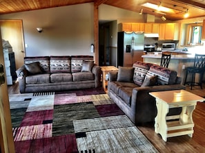 New high quality sofa sleeper in open living/kitchen/dining area.