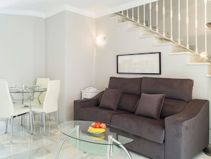 Furniture, Living Room, Room, Couch, Property, Interior Design, Sofa Bed, Table, Wall, Floor