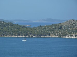 Water, Sky, Mountain, Azure, Watercraft, Boat, Coastal And Oceanic Landforms, Lake, Horizon, Tree