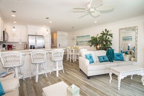 Enter into the Bright Open Concept Living/Kitchen/Dining Areas from the of deck