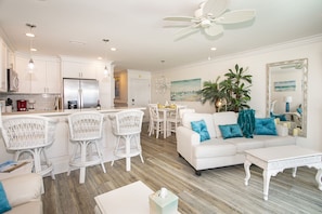 Enter into the Bright Open Concept Living/Kitchen/Dining Areas from the of deck