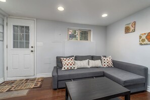 living room sofa with front door entrance