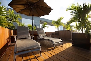 sun loungers on roof top deck