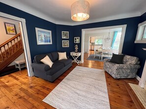 Sitting room with couch and 2 swivel chairs