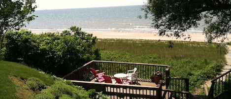 View of the private beach and decks from back yard.