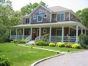 Front of House w/ Covered Wrap Porch & Swing