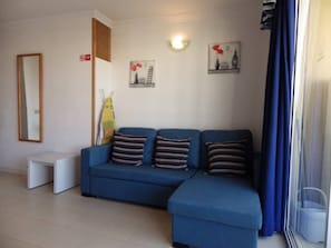 One bedroom studio with pool views. The apartment has 2 single beds and a sofa bed. The kitchen has a microwave, hob, kettle and toaster. The lounge has a TV and free Wifi with speeds up to 300 Mbps.