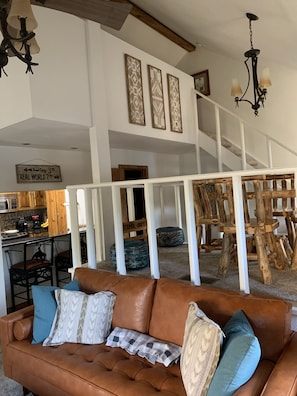 Game room and loft adjacent to the family room area.