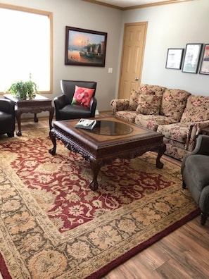 There is plenty of room in the living room for the family and friends to gather.