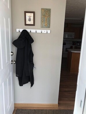 Entry off the front deck .  Coat rack and boot/shoe trays are found here. 