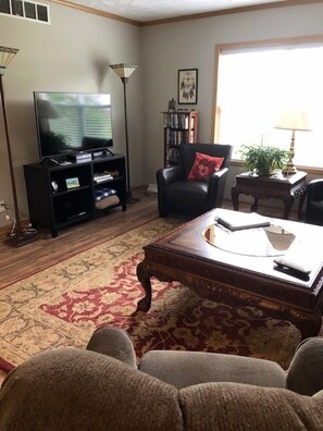 Flat screen TV and DVDs in the living room.  
