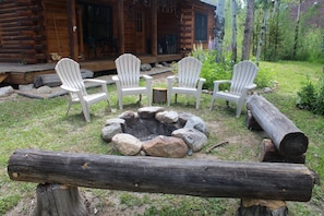 Enjoy an evening fire, chairs and log benches surround the fire pit